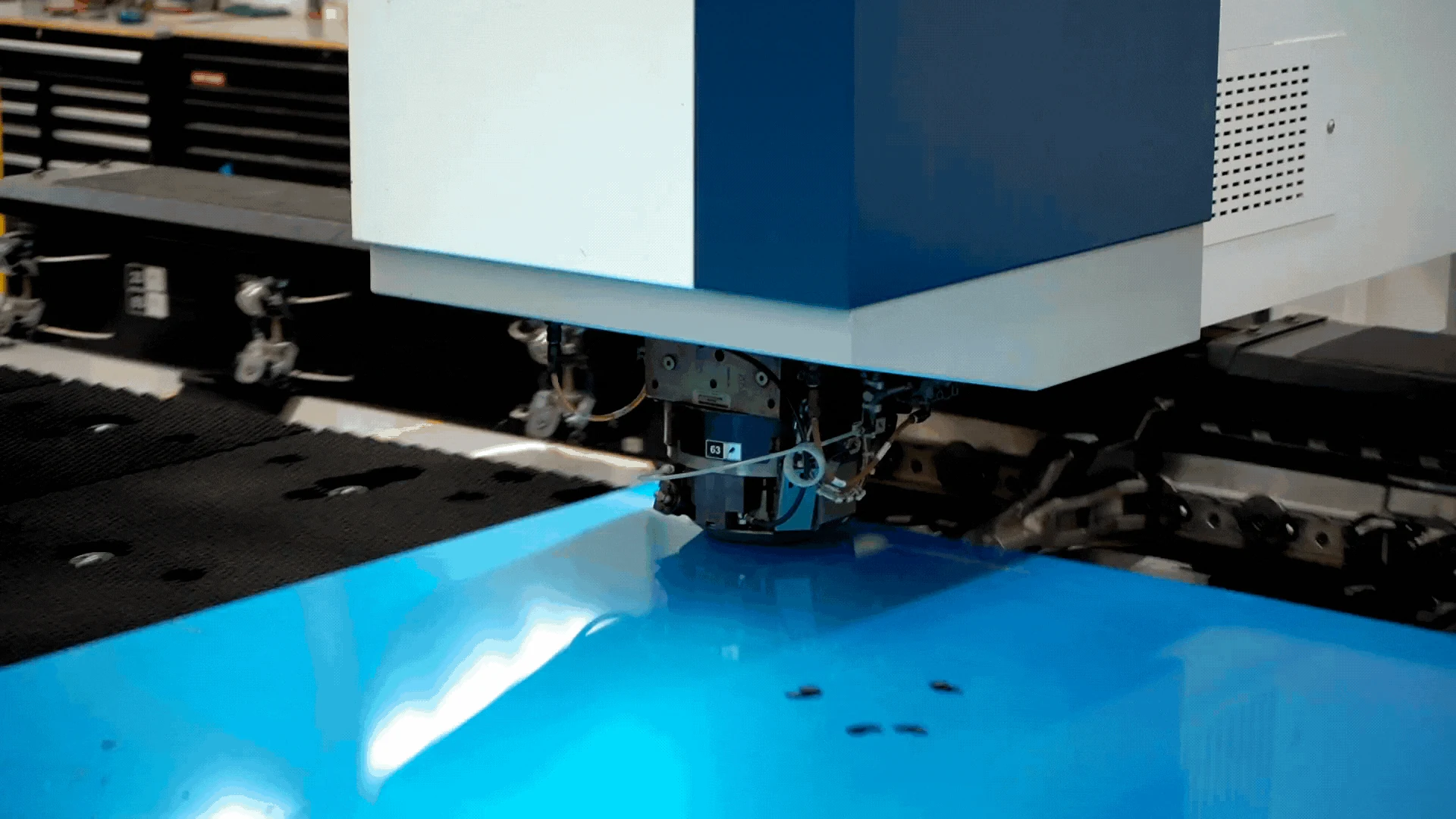 CNC sheet metal punching machine fabricating architectural metal panels