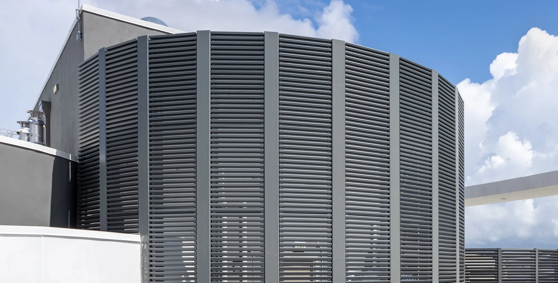 Dark gray rooftop louver enclosure screening mechanical equipment
