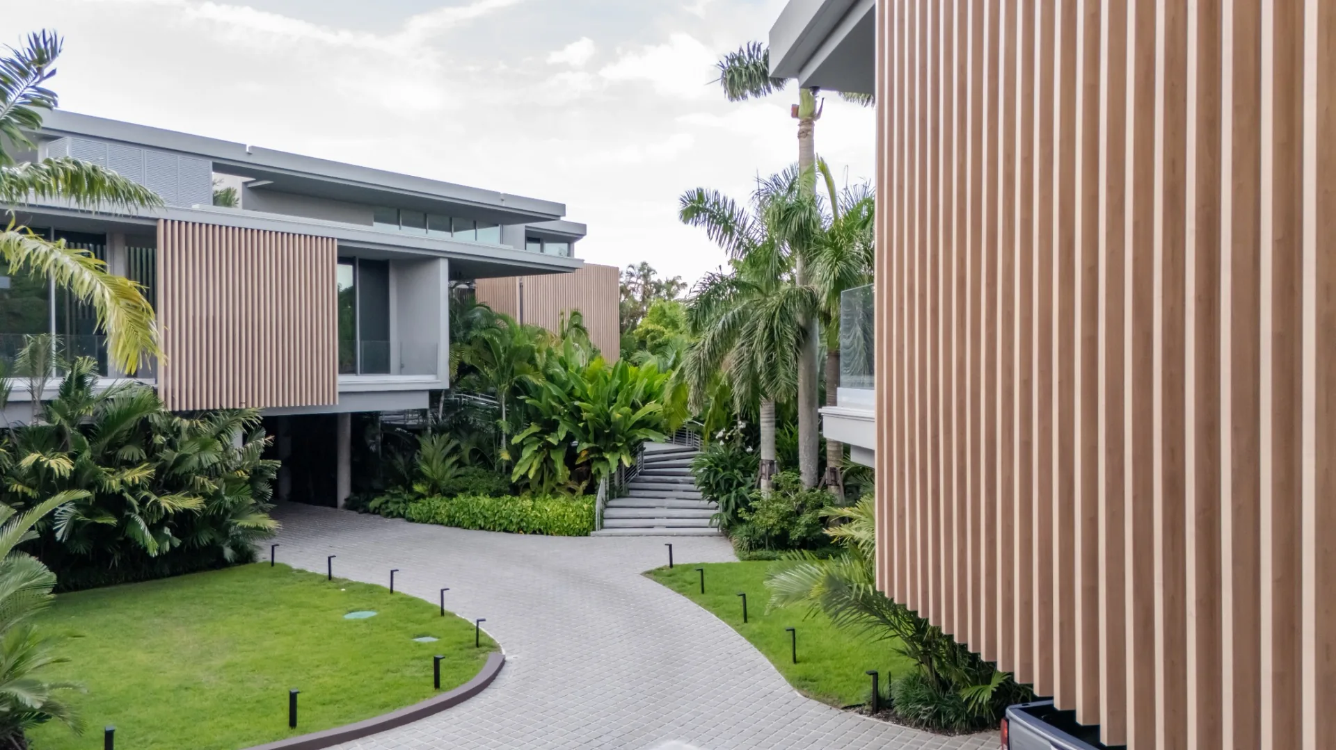 Luxury residence with vertical wood look aluminum architectural battens